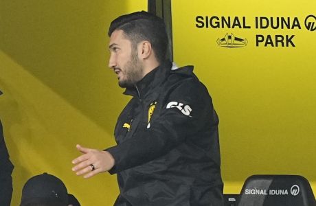 Assistant coach Nuri Sahin, right, talks to Dortmund's head coach Edin Terzic during the German Bundesliga soccer match between Borussia Dortmund and TSG Hoffenheim in Dortmund, Germany, Sunday, Feb. 25, 2024. (AP Photo/Martin Meissner)