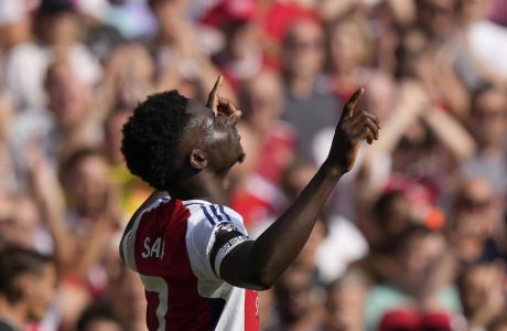 Arsenal's Bukayo Saka celebrates after scoring his side's second goal during the English Premier League soccer match between Arsenal and Wolverhampton Wanderers at Emirates Stadium in London, England, Saturday, Aug. 17, 2024. (AP Photo/Frank Augstein)