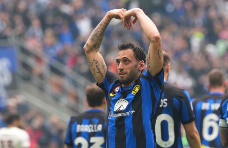 Inter Milan's Hakan Calhanoglu celebrates after scoring his side's second goal from a penalty kick during a Serie A soccer match between Inter Milan and Torino at the San Siro stadium in Milan, Italy, Sunday, April 28, 2024. (AP Photo/Luca Bruno)