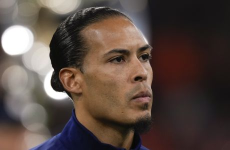 Netherlands' Virgil van Dijk during the line-up prior to the international friendly soccer match between Netherlands and Scotland at the Johan Cruyff ArenA, in Amsterdam, Netherlands, Friday, March 22, 2024. (AP Photo/Peter Dejong)