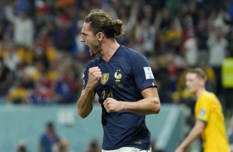 France's Adrien Rabiot celebrates after scoring his side's opening goal during the World Cup group D soccer match between France and Australia, at the Al Janoub Stadium in Al Wakrah, Qatar, Tuesday, Nov. 22, 2022. (AP Photo/Francisco Seco)