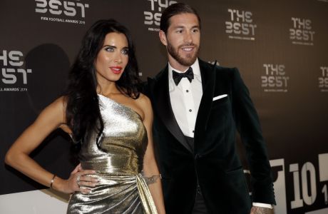 Real Madrid's Sergio Ramos arrives with his partner Pilar Rubio to attend the Best FIFA soccer awards, in Milan's La Scala theater, northern Italy, Monday, Sept. 23, 2019. Netherlands defender Virgil van Dijk is up against five-time winners Cristiano Ronaldo and Lionel Messi for the FIFA best player award and United States forward Megan Rapinoe is the favorite for the women's award. (AP Photo/Luca Bruno)