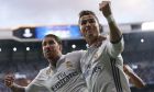 Real Madrid's Cristiano Ronaldo celebrates with Real Madrid's Sergio Ramos, left, after scoring the opening goal during the Champions League semifinals first leg soccer match between Real Madrid and Atletico Madrid at Santiago Bernabeu stadium in Madrid, Spain, Tuesday May 2, 2017. (AP Photo/Daniel Ochoa de Olza)