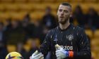 Manchester United's goalkeeper David de Gea during warm up before the English Premier League soccer match between Wolverhampton Wanderers and Manchester United at the Molineux Stadium in Wolverhampton, England, Saturday, Dec. 31, 2022. (AP Photo/Rui Vieira)