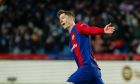 Barcelona's Robert Lewandowski celebrates scoring his side's 2nd goal during the Spanish La Liga soccer match between Barcelona and Granada at the Olimpic Lluis Companys stadium in Barcelona, Spain, Sunday, Feb. 11, 2024. (AP Photo/Joan Monfort)