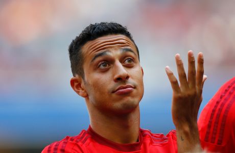 Bayern's Thiago from Spain gestures during a show training and team presentation for the upcoming German first division Bundesliga soccer season at the Allianz Arena in Munich, Germany, on Saturday, July 11, 2015. (AP Photo/Matthias Schrader)