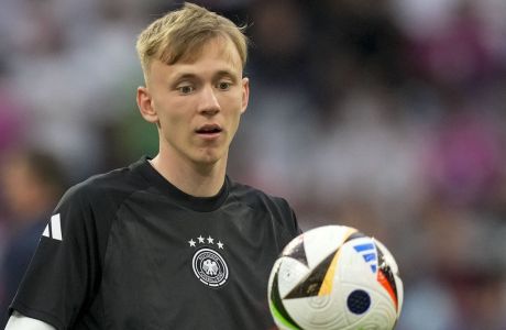 Germany's Maximilian Beier controls the ball during warm up before a Group A match between Germany and Scotland at the Euro 2024 soccer tournament in Munich, Germany, Friday, June 14, 2024. (AP Photo/Antonio Calanni)