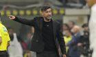 AC Milan's head coach Paulo Fonseca gestures during the Serie A soccer match between Inter Milan and AC Milan at the San Siro stadium in Milan, Italy, Sunday, Sept.22, 2024. (AP Photo/Luca Bruno)