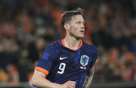 Netherlands' Wout Weghorst runs during the international friendly soccer match between The Netherlands and Canada at De Kuip stadium in Rotterdam, Netherlands, Thursday, June 6, 2024. (AP Photo/Patrick Post)