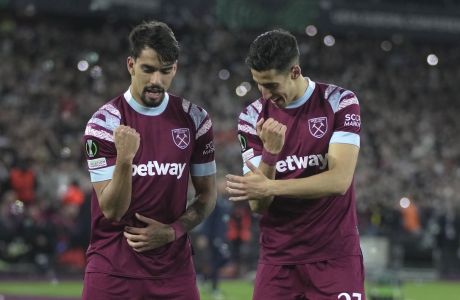 West Ham's Lucas Paqueta, left, celebrates with West Ham's Nayef Aguerd after scoring his side's second goal during the Conference League soccer match between West Ham and Gent at the London stadium in London, England, Thursday, April 20, 2023. (AP Photo/Kin Cheung)