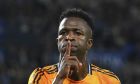 Real Madrid's Vinicius Junior celebrates after scoring the opening goal with a penalty kick during a Spanish La Liga soccer match between Real Sociedad and Real Madrid at the Reale Arena in San Sebastian, Spain, Saturday, Sept. 14, 2024. (AP Photo/Miguel Oses)