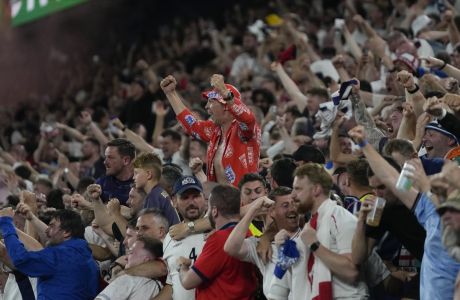 Fans celebrate after England's Ollie Watkins scores his side's 2nd goal against Netherlands during a semifinal at the Euro 2024 soccer tournament in Dortmund, Germany, Wednesday, July 10, 2024. (AP Photo/Thanassis Stavrakis)