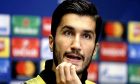 Dortmund's Nuri Sahin attends a press conference before a training session at Wembley stadium in London, Tuesday, Sept. 12, 2017. Dortmund play Tottenham Hotspur in a Champions League Group H soccer match at Wembley on Wednesday. (AP Photo/Matt Dunham)