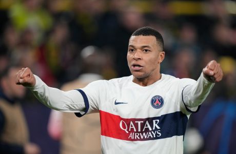 PSG's Kylian Mbappe celebrates after scoring a goal that was later disallowed during the Champions League Group F soccer match between Borussia Dortmund and Paris Saint-Germain at the Signal Iduna Park in Dortmund, Germany, Wednesday, Dec. 13, 2023. (AP Photo/Martin Meissner)