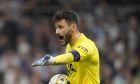 Tottenham's goalkeeper Hugo Lloris gestures during the Champions League Group D soccer match between Marseille and Tottenham Hotspur at the Stade Velodrome in Marseille, France, Tuesday, Nov. 1, 2022. (AP Photo/Daniel Cole)