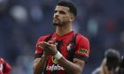 Bournemouth's Dominic Solanke celebrates their team's 3-2 victory over Tottenham Hotspur at the end of the English Premier League soccer match between Tottenham Hotspur and Bournemouth at Tottenham Hotspur Stadium, in London, England, Saturday, April 15, 2023. (AP Photo/Ian Walton)